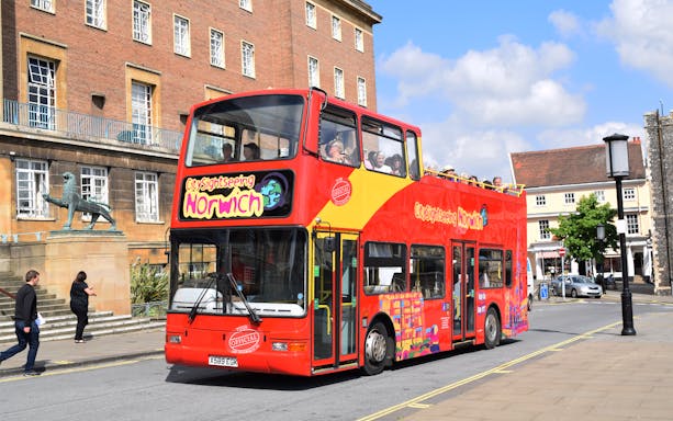Open-top sightseeing bus on 24-Hr Hop-On Hop-Off Tour in Norwich city center.