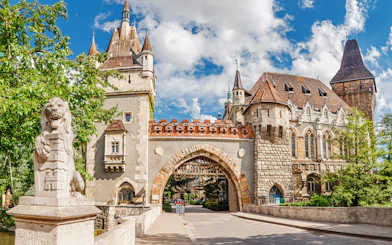 Vajdahunyad Castle entrance gate with lion statue, Budapest, Hungary.
