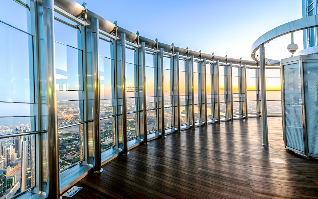 Observation deck view from Burj Khalifa At The Top, overlooking Dubai cityscape.