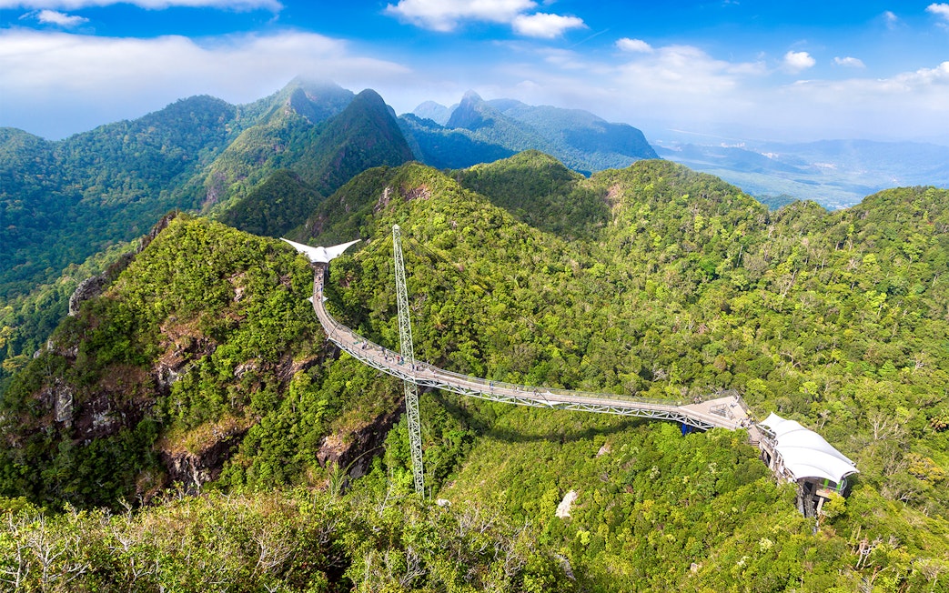 Langkawi SkyBridge spanning lush green mountains in Malaysia.