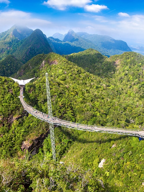 Langkawi SkyBridge spanning lush green mountains in Malaysia.