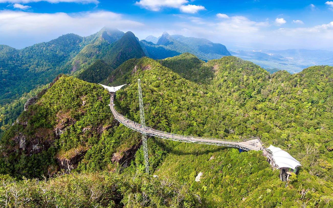 Langkawi SkyBridge spanning lush green mountains in Malaysia.
