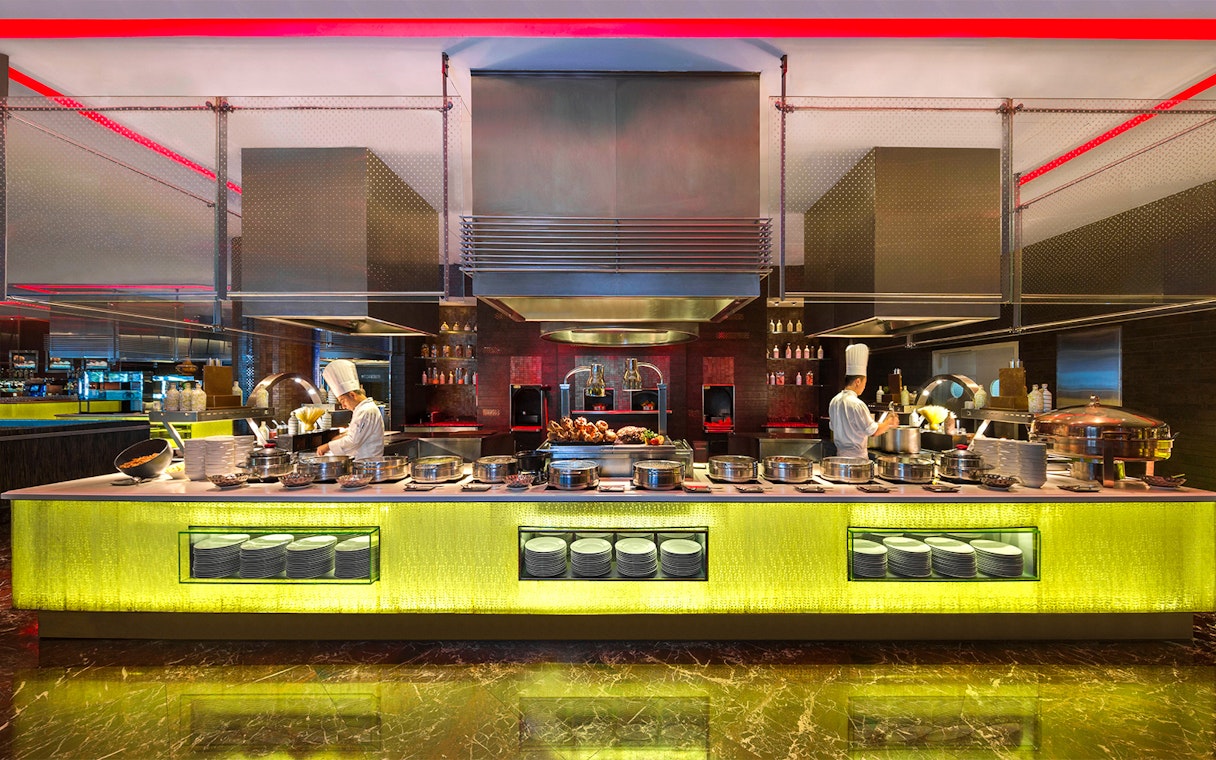 Dinner buffet setup at Atlantis the Palm with chefs preparing dishes.