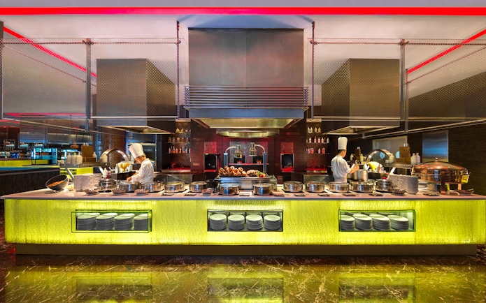 Dinner buffet setup at Atlantis the Palm with chefs preparing dishes.