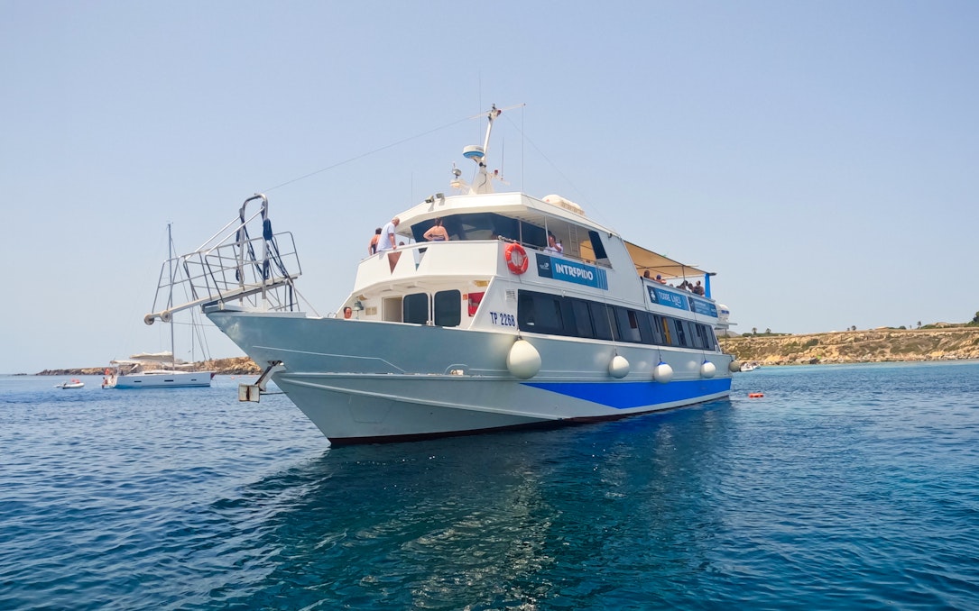 Cruise ship on clear waters near Favignana and Levanzo, departing from Trapani.