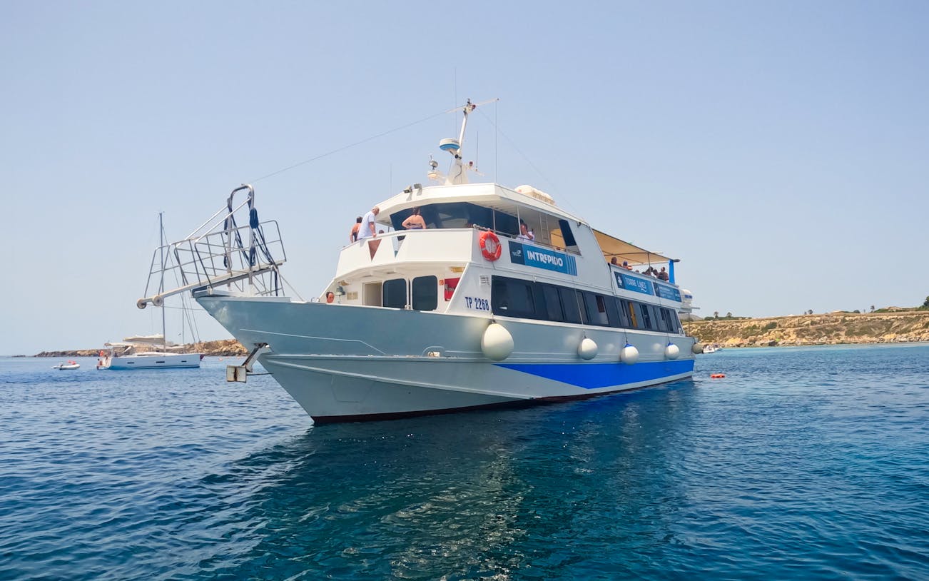 Cruise ship on clear waters near Favignana and Levanzo, departing from Trapani.