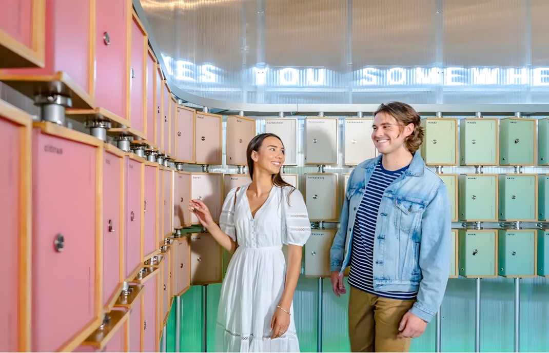 Visitors exploring scent boxes at World of Coca-Cola, Atlanta.