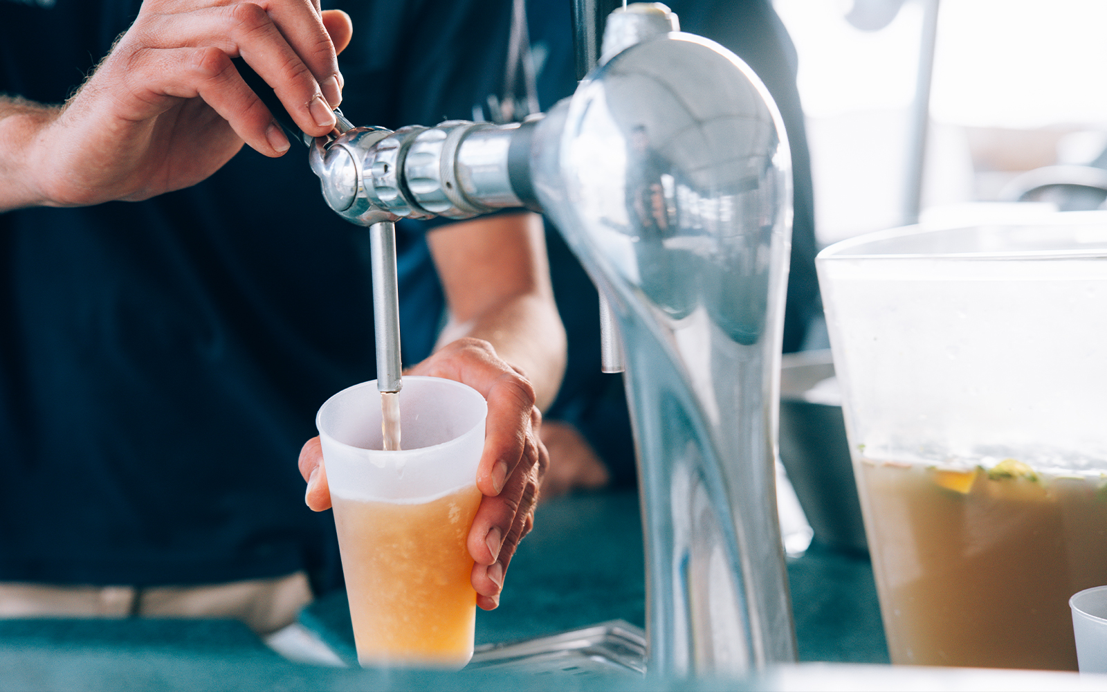 Pouring drinks on a boat in Lanzarote during sunset.
