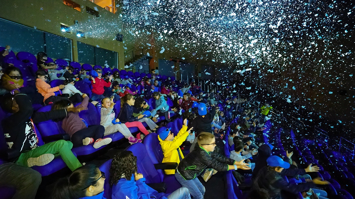 Visitors enjoying a 4D cinema experience at Oceanogràfic, Valencia.