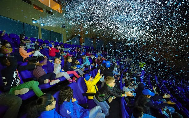 Visitors enjoying a 4D cinema experience at Oceanogràfic, Valencia.