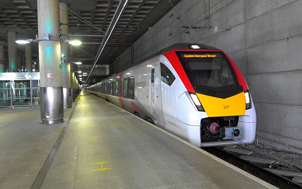 Stansted Express train arriving at a London station platform.