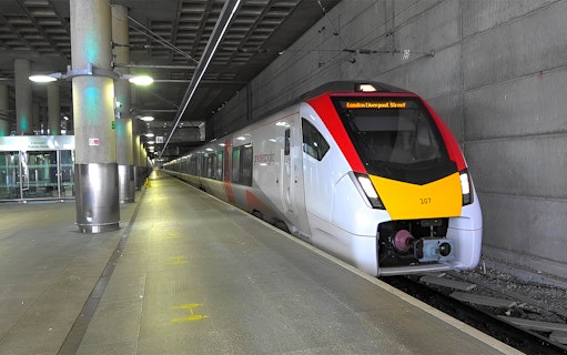 Stansted Express train arriving at a London station platform.