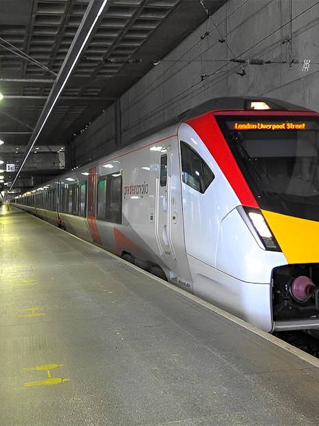 Stansted Express train arriving at a London station platform.