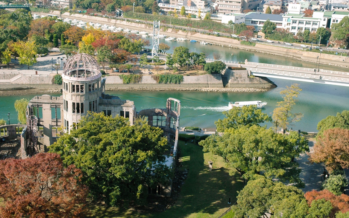 Hiroshima Peace Memorial with river and boat, view from above.