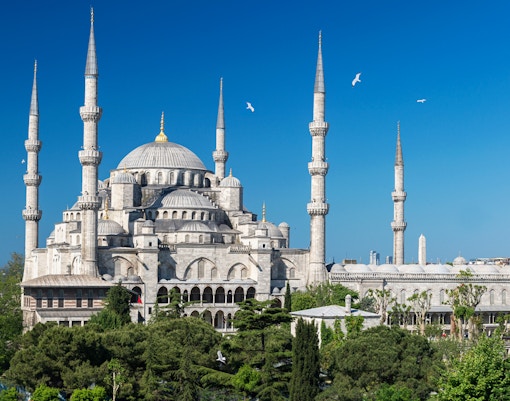 Blue Mosque exterior with minarets and domes in Istanbul, Turkey.