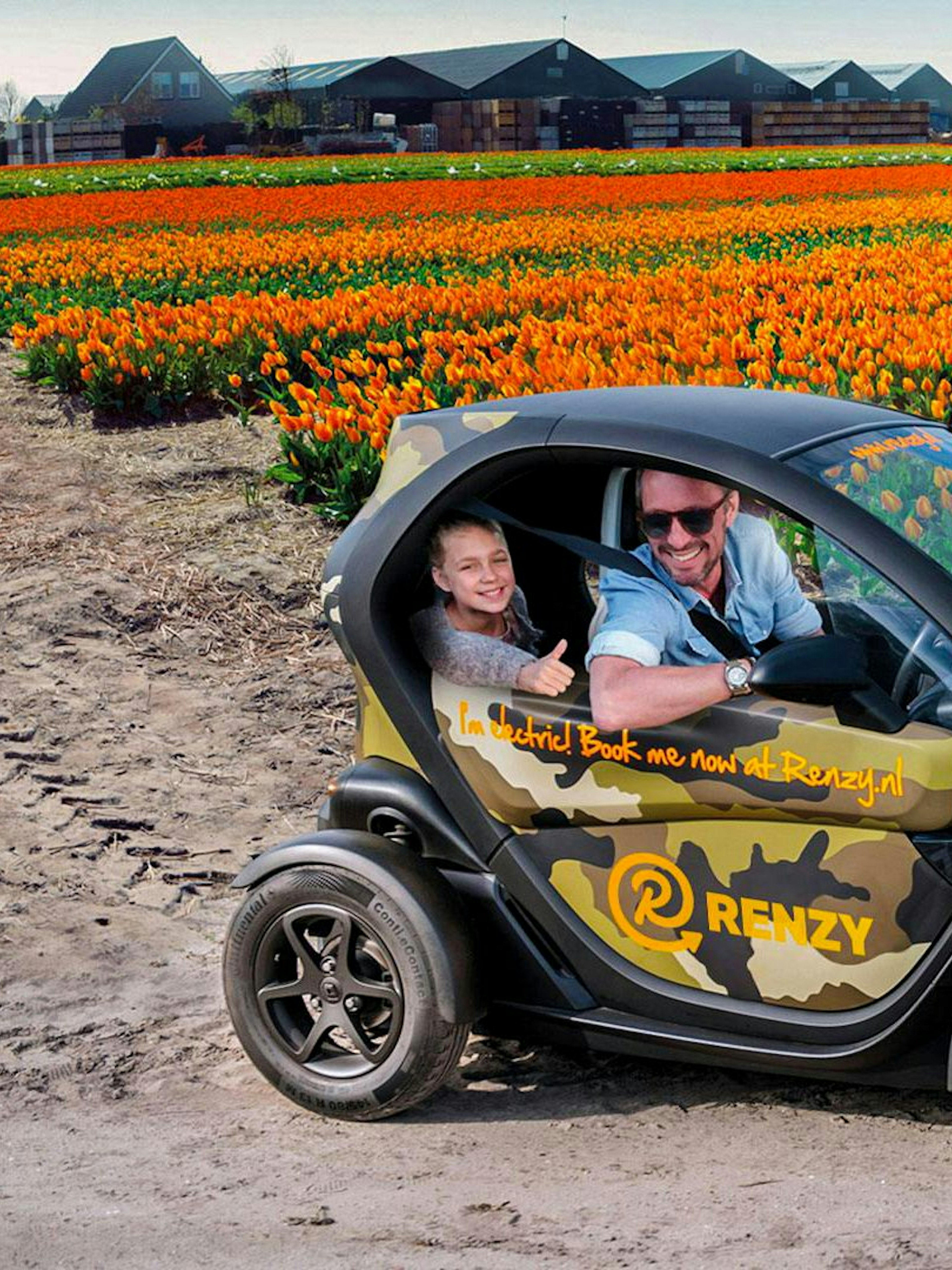 Electric car driving through tulip fields in Keukenhof during self-drive audio tour.