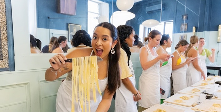 People making pasta at a cooking class in Rome.