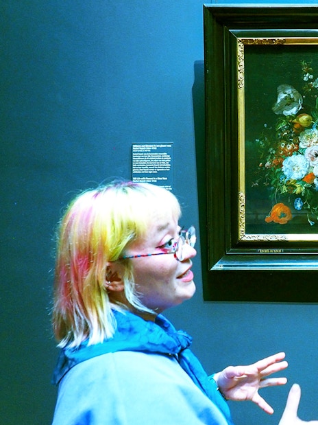 Guide explaining a floral painting at the Rijksmuseum during a private tour.