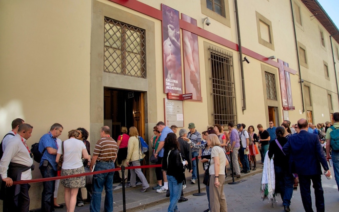Visitors queuing at the Accademia Gallery entrance in Florence.