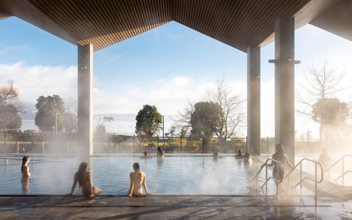 Visitors enjoying mineral bathing in the Hydropool at Wai Ariki Hot Springs, Rotorua.