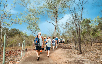 Group walking on a trail in Litchfield National Park, Australia.