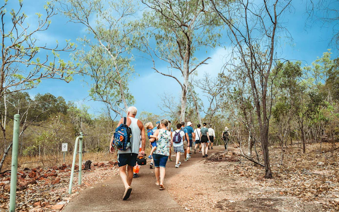 Group walking on a trail in Litchfield National Park, Australia.