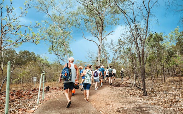 Group walking on a trail in Litchfield National Park, Australia.