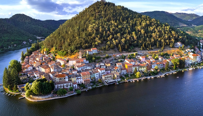 Piediluco Lake with boats and lush hills in the background, Italy.