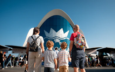 Family standing at Oceanogràfic Valencia entrance.
