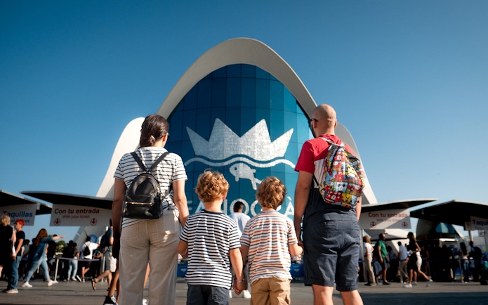Family standing at Oceanogràfic Valencia entrance.