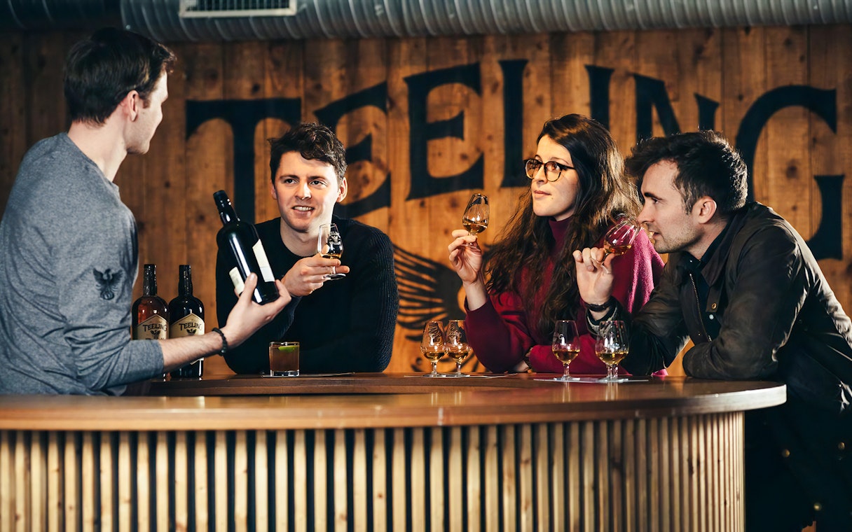 Visitors tasting whiskey at Teeling Distillery in Dublin.