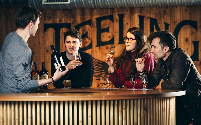 Visitors tasting whiskey at Teeling Distillery in Dublin.