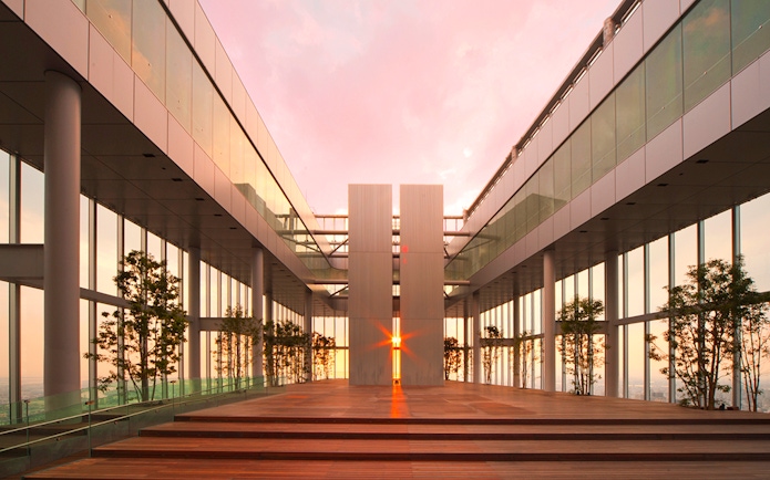 Harukas 300 Observatory interior with sunset view through glass walls.