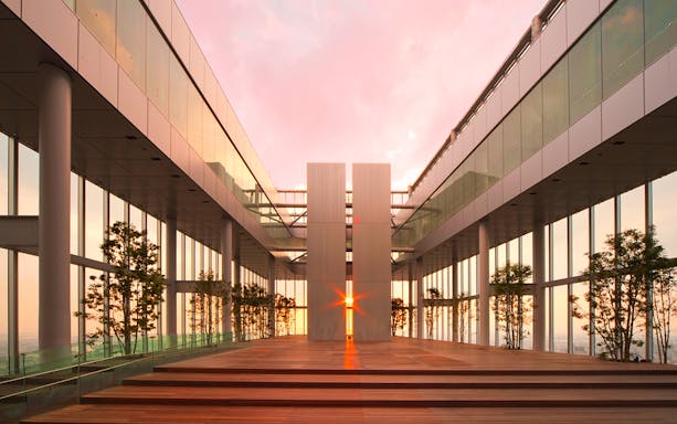 Harukas 300 Observatory interior with sunset view through glass walls.