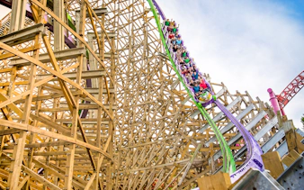 Roller coaster riders on THE JOKER™ at Six Flags Discovery Kingdom, California.