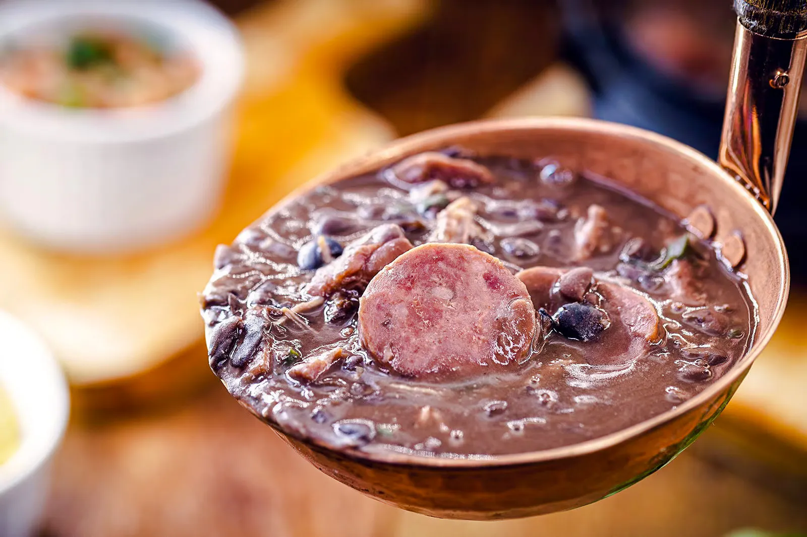 Traditional Brazilian feijoada with sausage and beans in Rio de Janeiro.