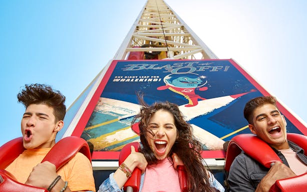 Riders on Zombieland Blast Off roller coaster at Motiongate Dubai.