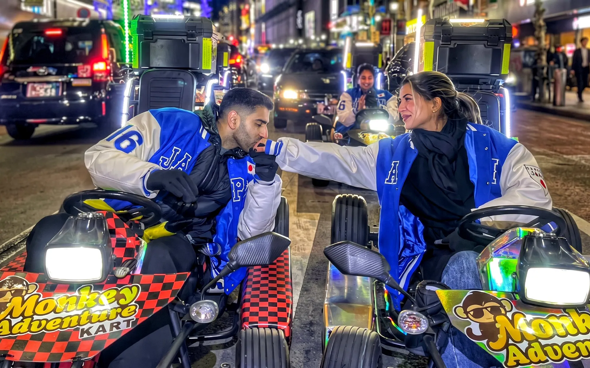Go-kart riders in Tokyo's Shibuya Crossing during a night tour.