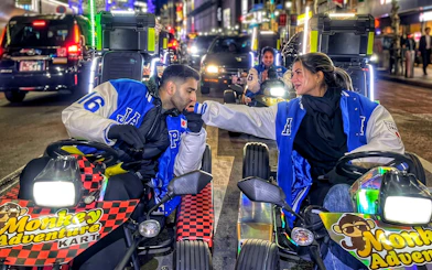 Go-kart riders in Tokyo's Shibuya Crossing during a night tour.