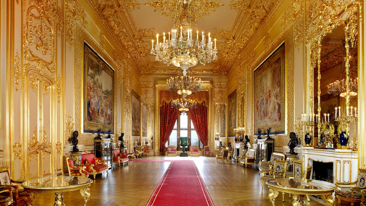 Windsor Castle's opulent interior with chandeliers and ornate gold detailing.
