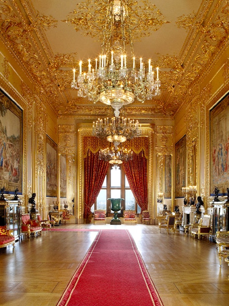 Windsor Castle's opulent interior with chandeliers and ornate gold detailing.