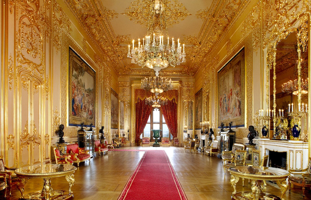 Windsor Castle's opulent interior with chandeliers and ornate gold detailing.
