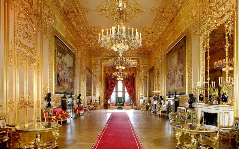 Windsor Castle's opulent interior with chandeliers and ornate gold detailing.