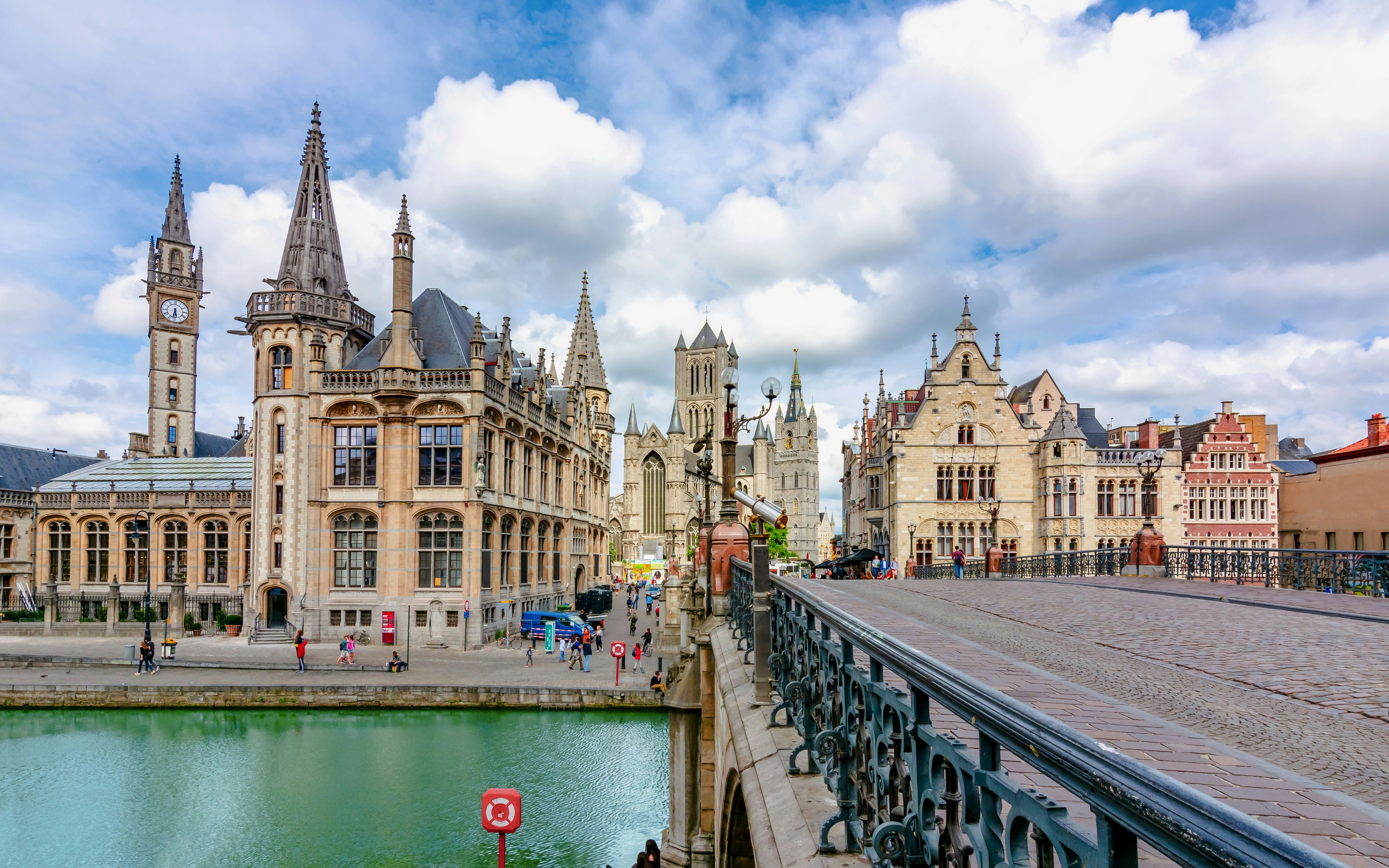 St. Michael's Bridge in Ghent with historic buildings and canal view.