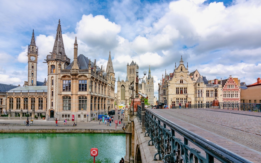 St. Michael's Bridge in Ghent with historic buildings and canal view.