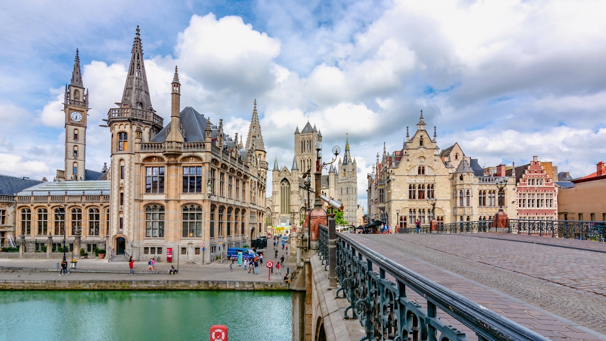 St. Michael's Bridge in Ghent with historic buildings and canal view.