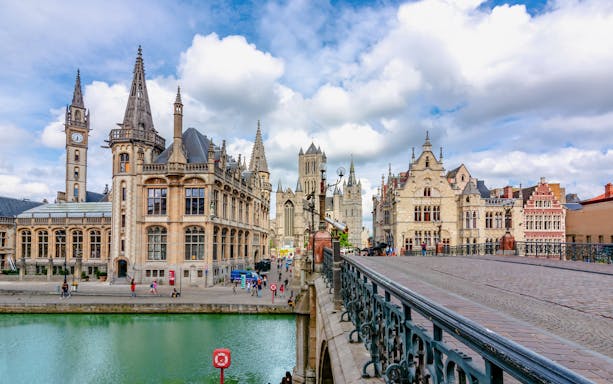 St. Michael's Bridge in Ghent with historic buildings and canal view.