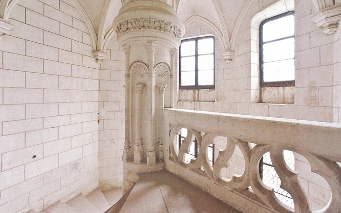 Stone spiral staircase inside Domaine du Chaumont-sur-Loire Castle, Loire Valley.