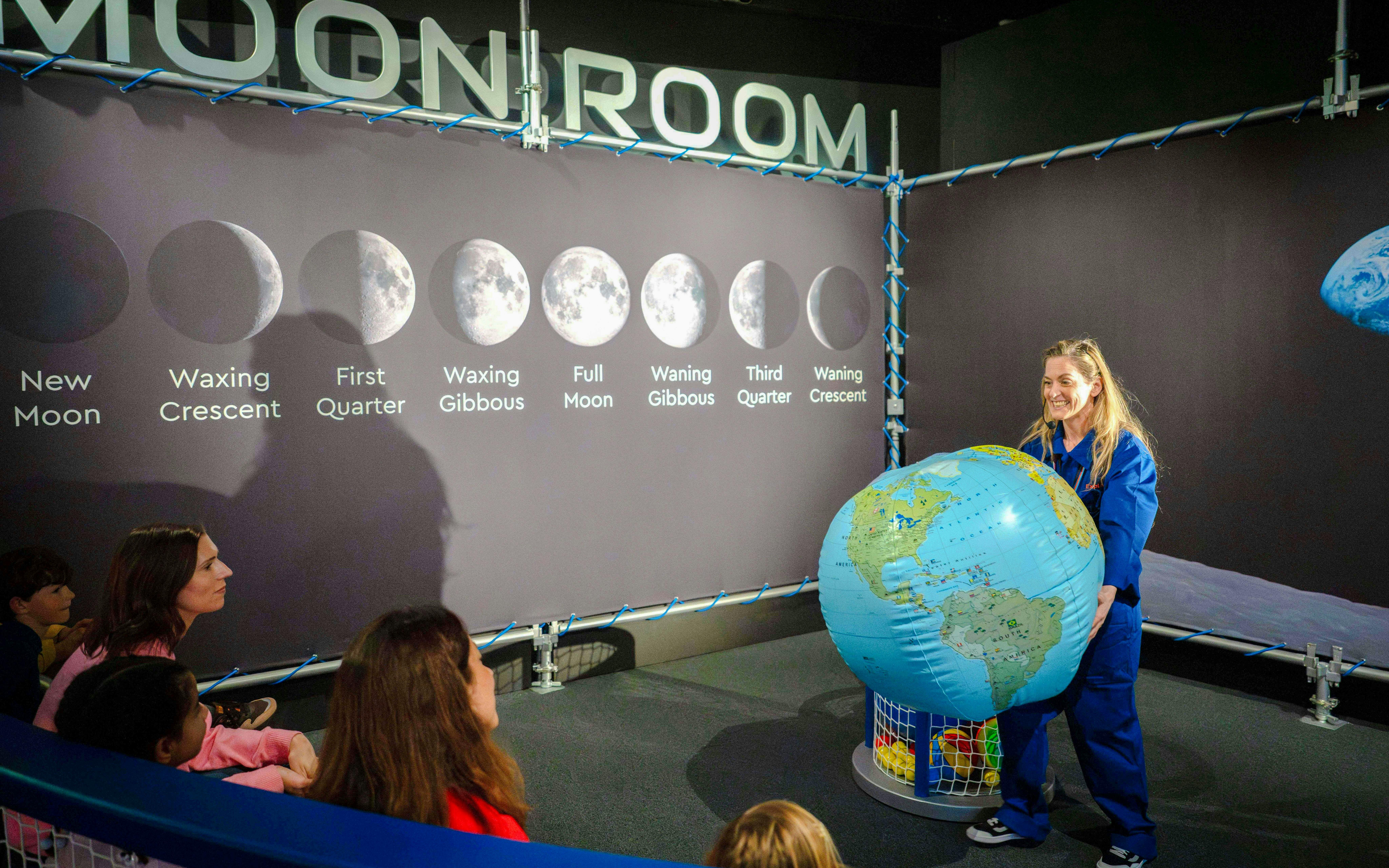 Guests learning about moon phases at the National Maritime Museum event.