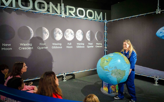 Guests learning about moon phases at the National Maritime Museum event.